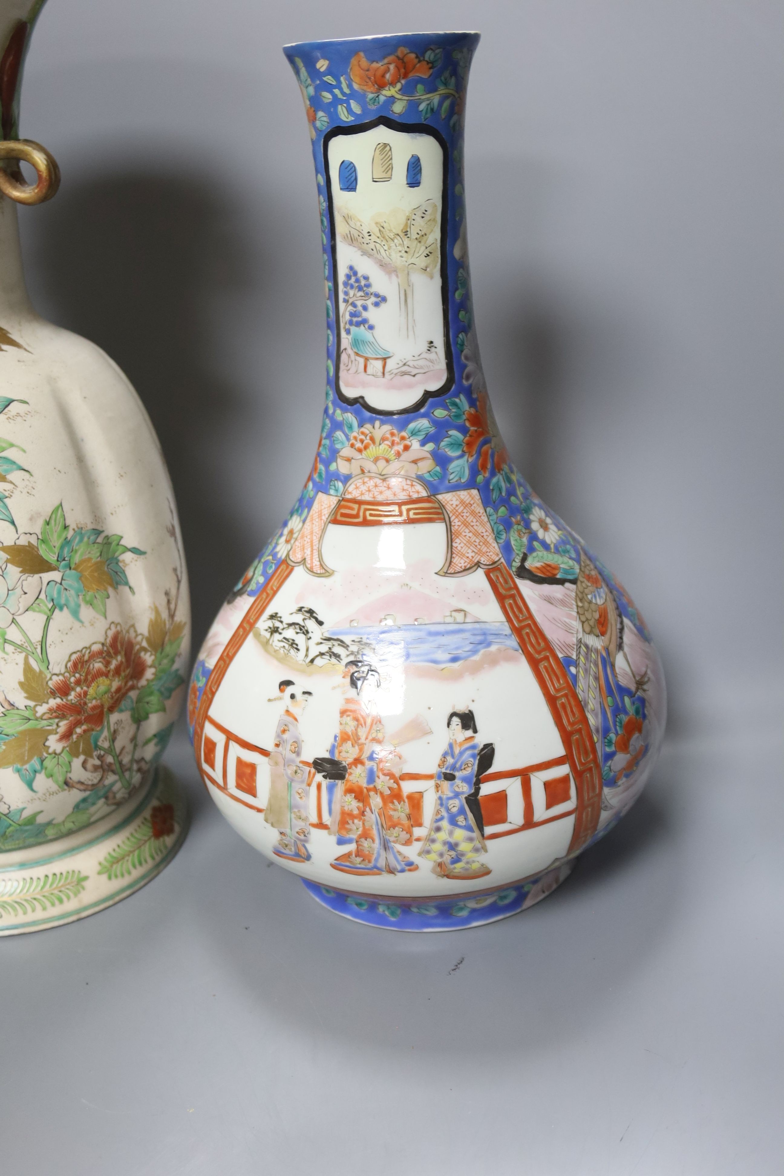 A Japanese porcelain bottle vase and a large Satsuma pottery vase (restoration) 39cm (2)